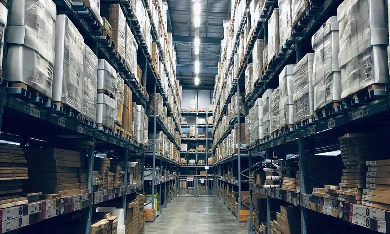 High-bay warehouse aisle with loaded pallet racking